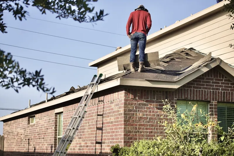 Professional roofer working on a residential roof in Meridian Park